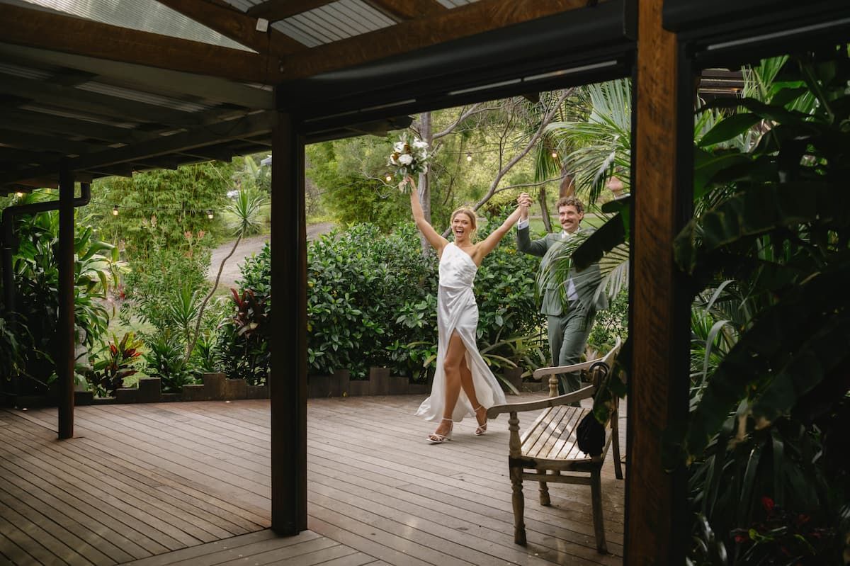 Two Dancers in a Wooden Pavilion, Arms Raised Amid Lush Greenery โ Seed + Salt Photography In Smithtown, NSW