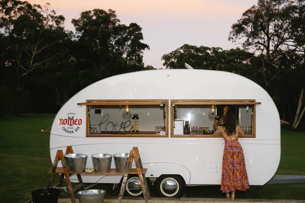 White Camper Trailer at Dusk With a Woman at the Window โ Seed + Salt Photography In Smithtown, NSW