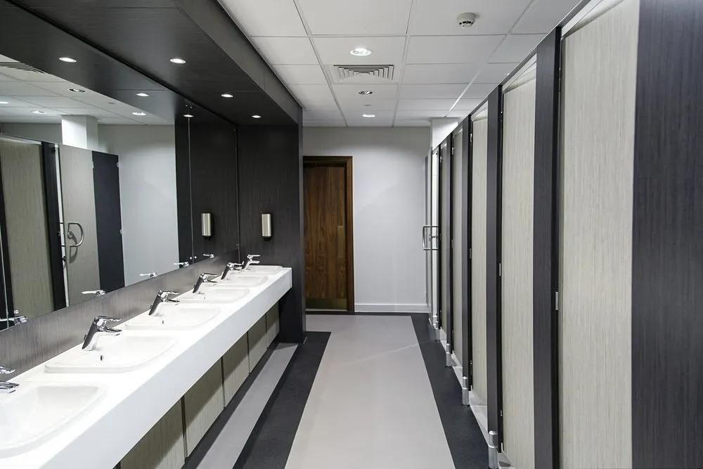 A Long Hallway with A Lot of Sinks and Mirrors — Gillespie Plumbing in Grafton, NSW