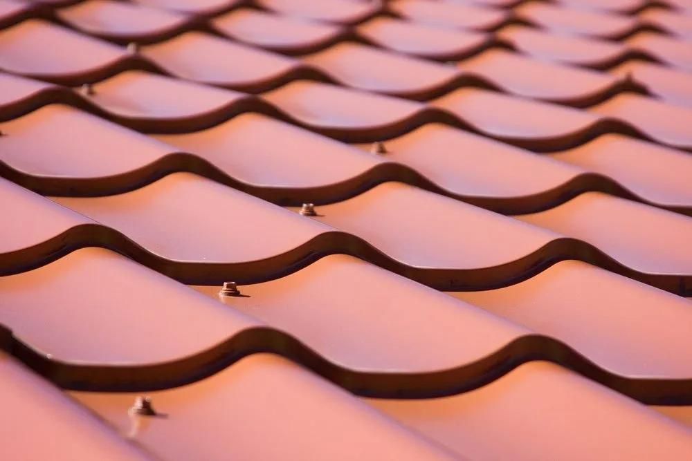 A Close up Of a Roof with A Pattern of Waves on It — Gillespie Plumbing in Grafton, NSW