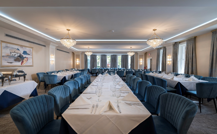 There is a long table in the middle of the room.