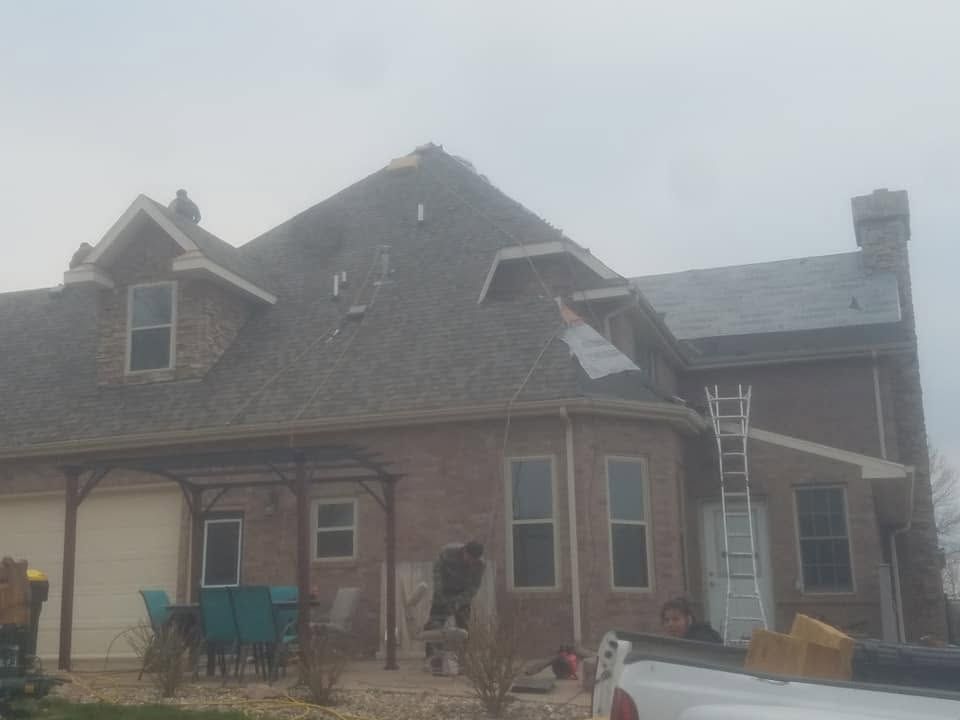 Residential roof repair on steep slope home in Sioux Falls, SD area