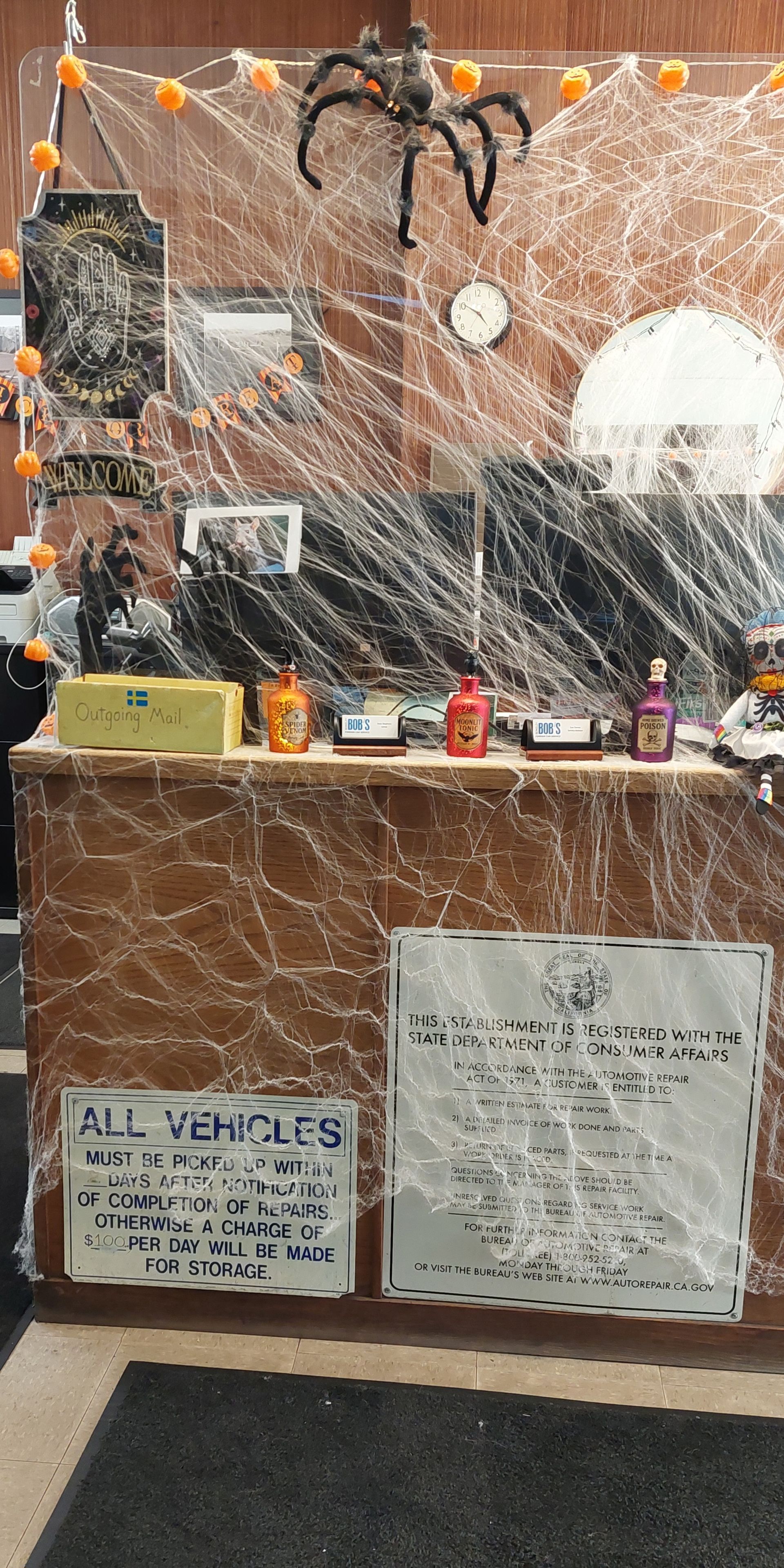 Auto Repair Shop Reception Desk with Halloween Decoration On