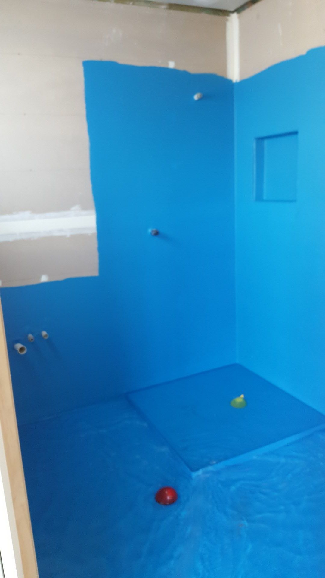 Worker utilising a brush for waterproofing, ensuring a leak-free surface — Leak Free Waterproofing in Unanderra, NSW