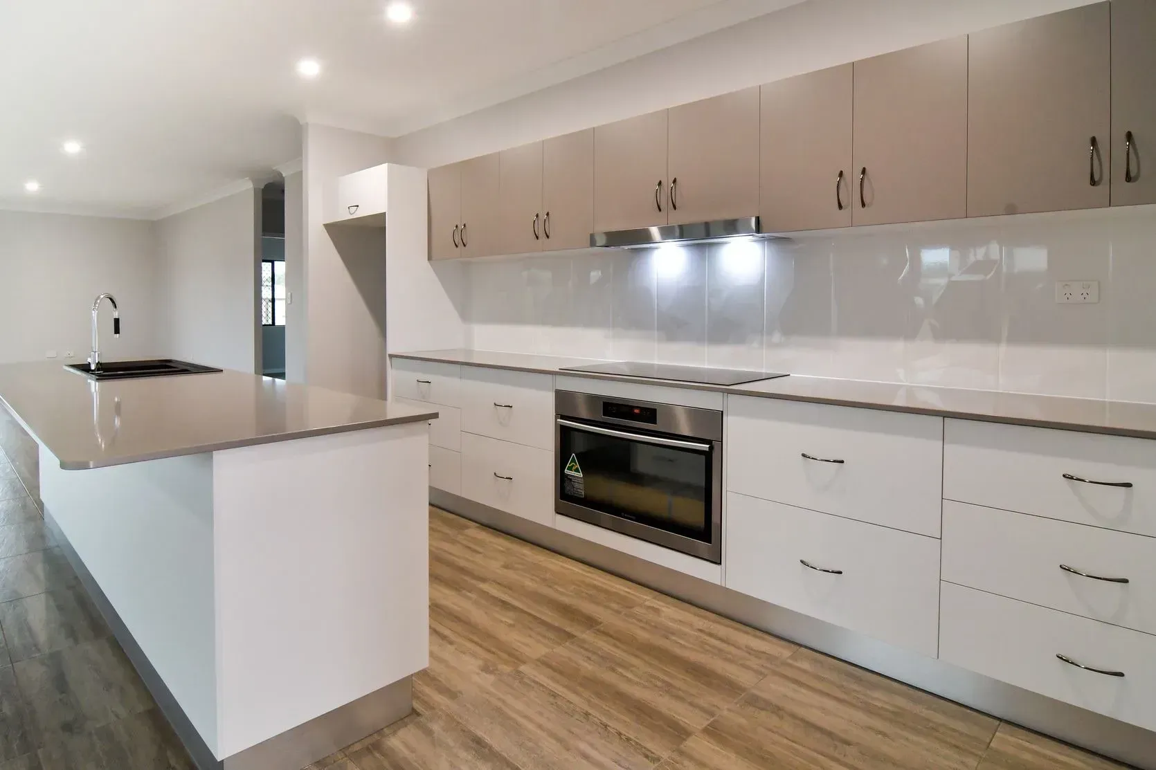 Kitchen and Dining Area With Wooden Table — B & C Cabinets in Mareeba, QLD