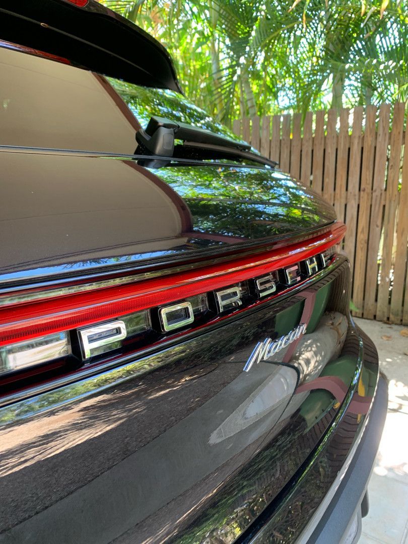 A Black Car is Parked on the Side of the Road — Best Car Detailing in Vincent, QLD