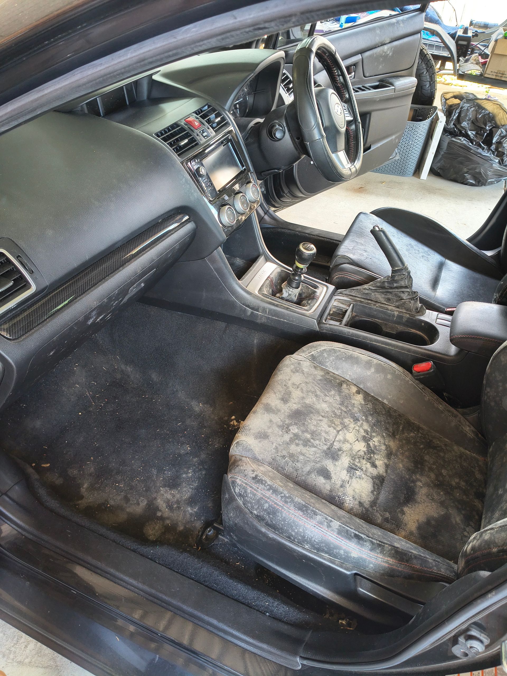Interior Of A Car Heavily Soiled With Mud And Debris, Covering Seats, Floor, And Dashboard — Best Car Detailing in Vincent, QLD