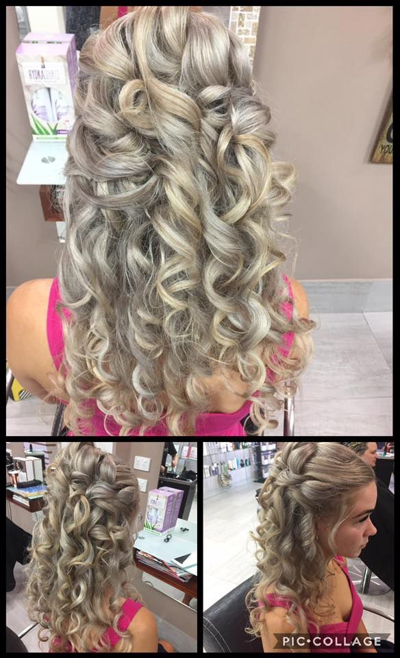 A Woman With Curly Hair is Getting Her Hair Done in a Salon — Instyle Hair on B in Berserker, QLD
