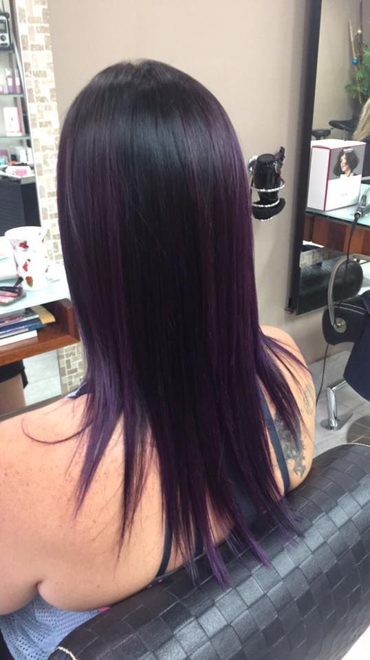 A Woman With Purple Hair is Sitting in a Chair in a Salon — Instyle Hair on B in Berserker, QLD