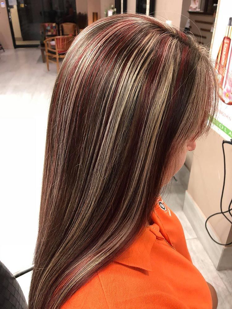 A Woman is Getting Her Hair Done in a Salon — Instyle Hair on B in Berserker, QLD
