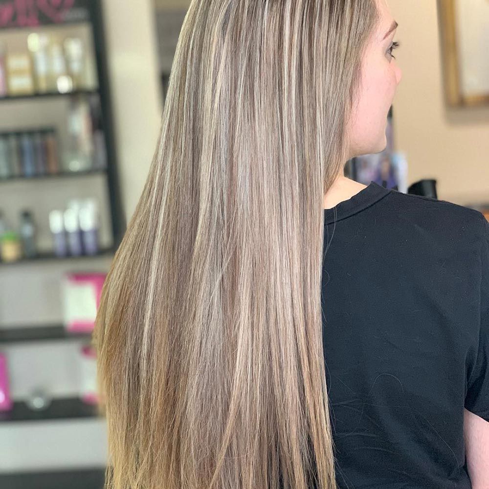A Woman With Blond and Brown Hair is Sitting in a Chair in a Salon — Instyle Hair on B in Berserker, QLD