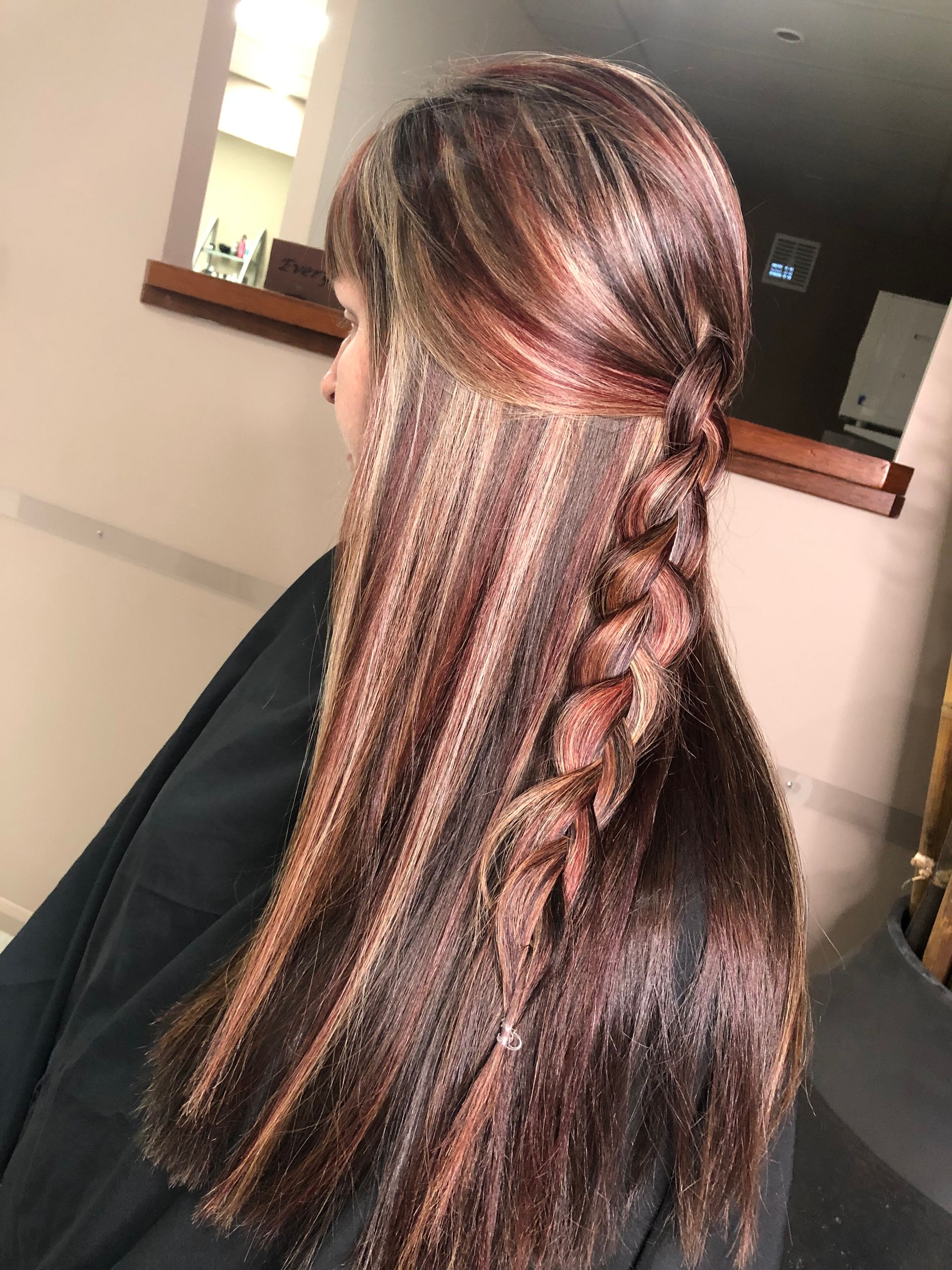 A Woman is with Red, Brown & Blonde hair with a plait in a Salon — Instyle Hair on B in Berserker, QLD