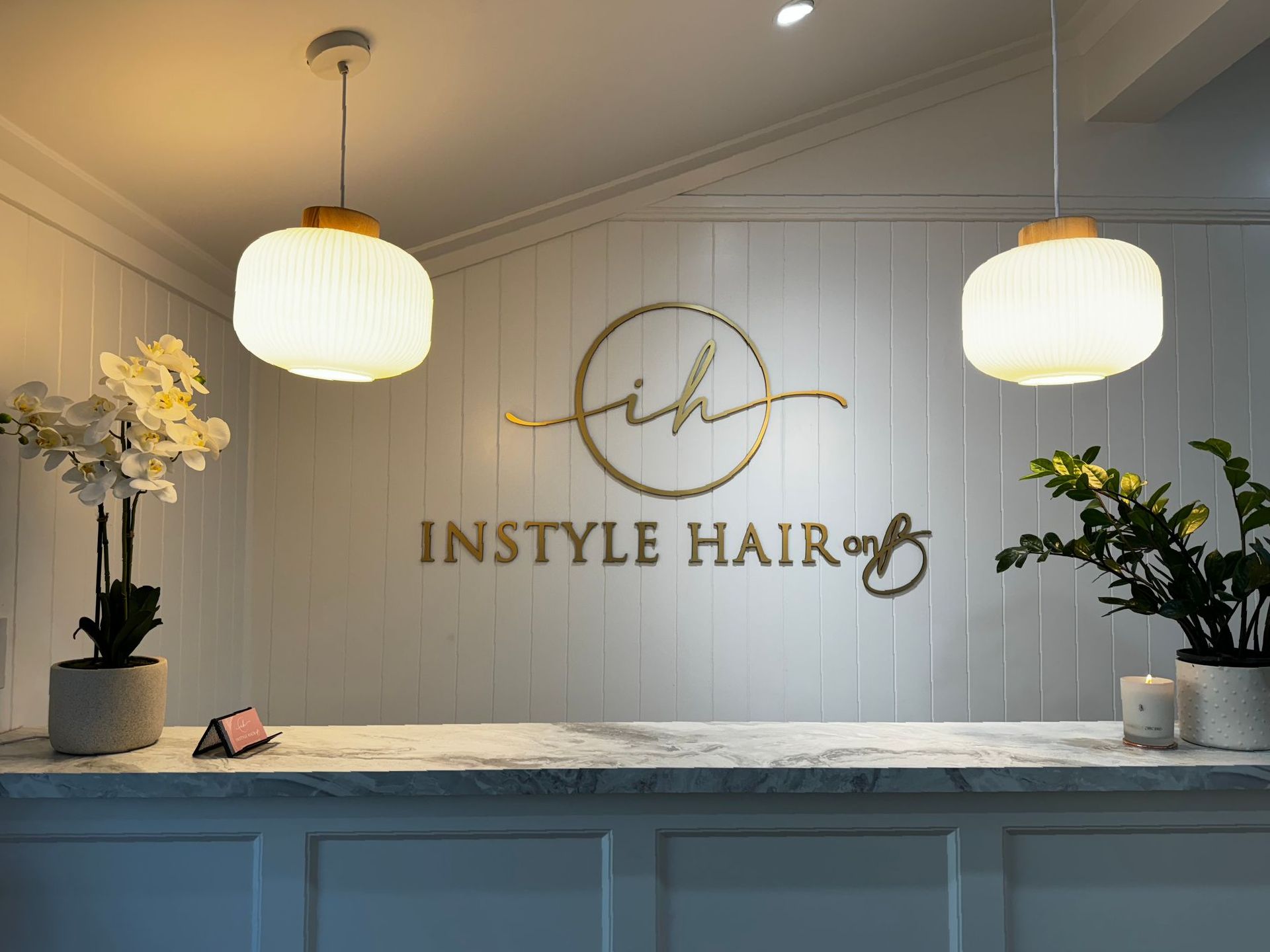 A Woman With Long Brown Hair is Standing With Her Eyes Closed — Instyle Hair on B in Berserker, QLD