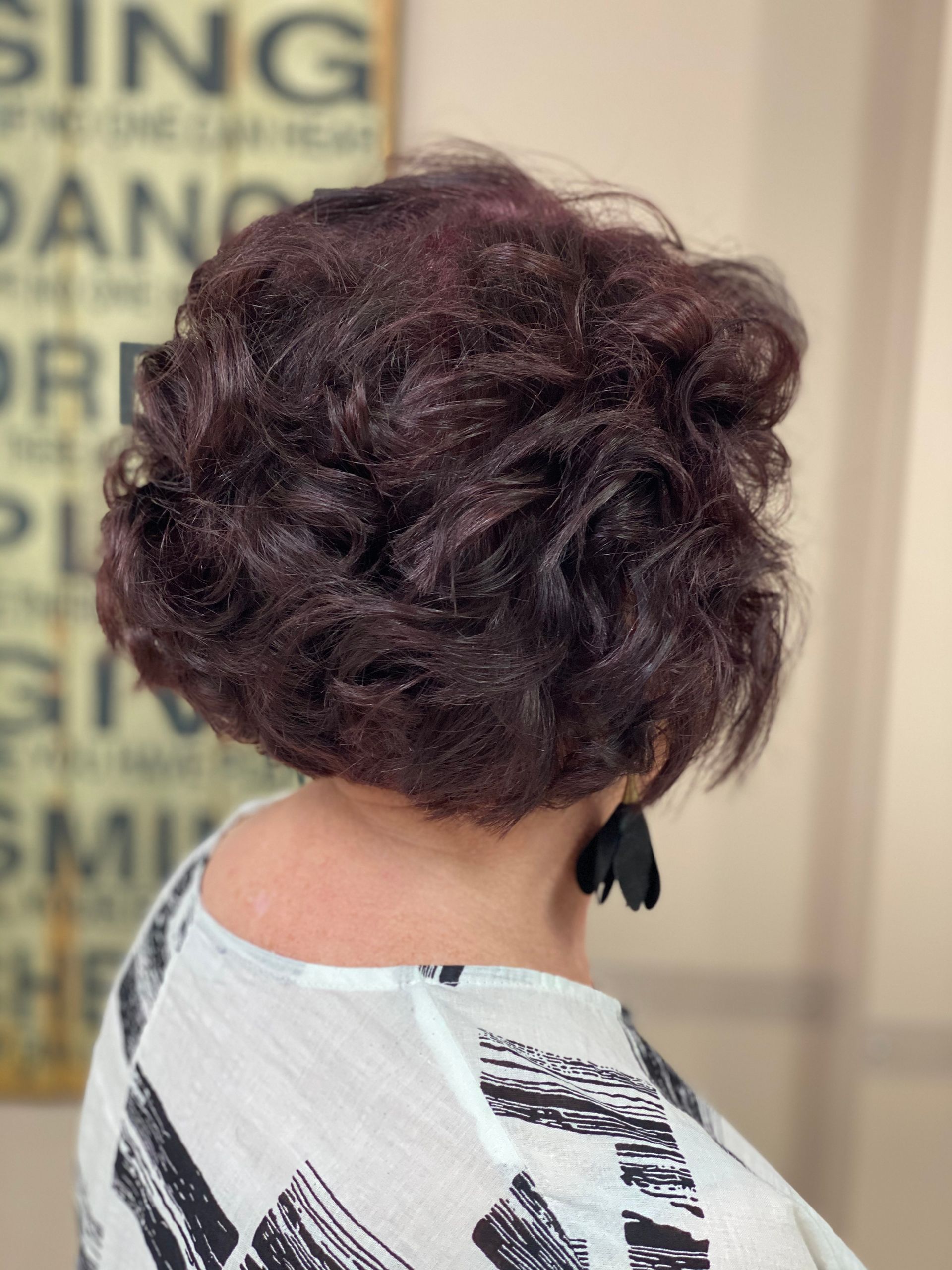 A Woman With Short Curled Red Hair after Hair Cut in a Salon — Instyle Hair on B in Berserker, QLD