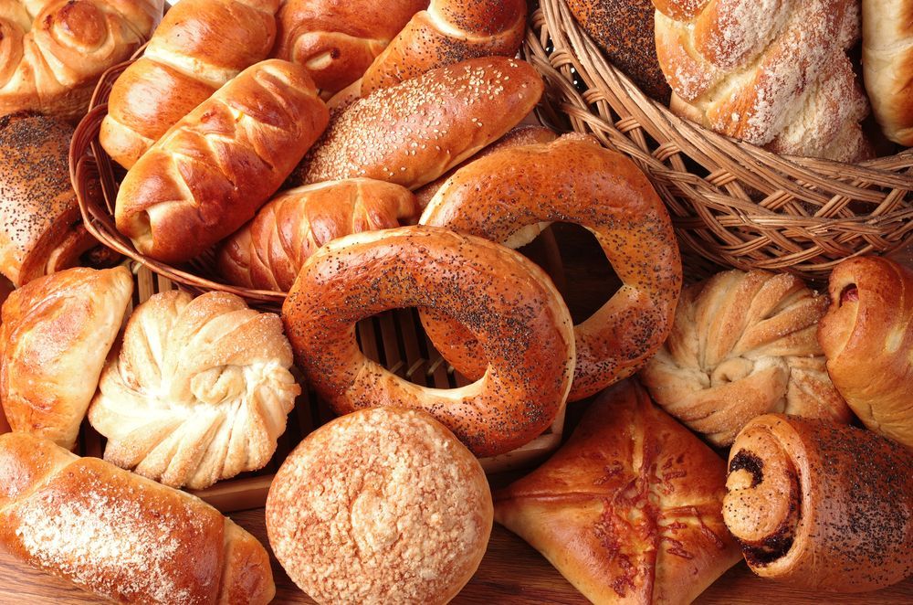 A Bunch of Different Types of Bread Are Sitting on a Table — Scotto's Food Logistics in Mitchell, ACT