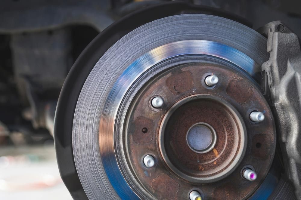 A Close Up Of A Brake Disc On A Car — Signature Mechanical In South Gladstone, QLD