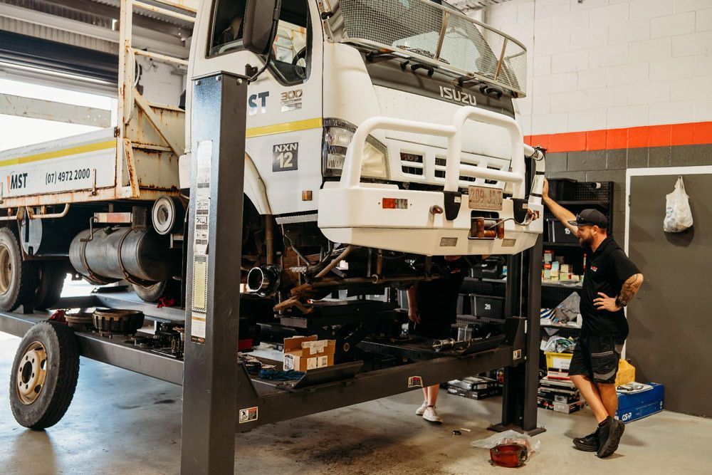 Mechanics Checking Truck Condition