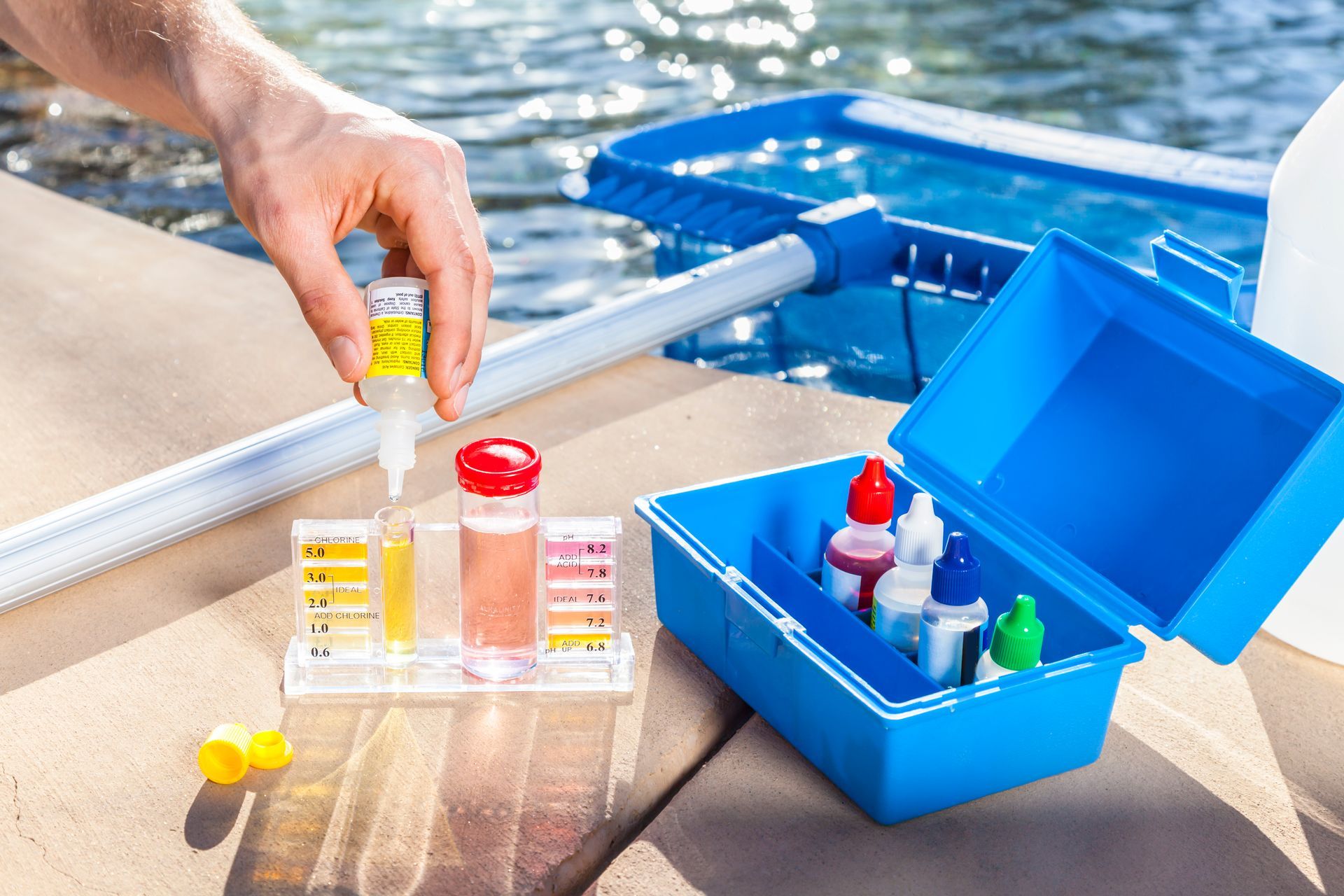 A Person Is Testing the Water in A Swimming Pool - Provo UT - Spa Doctor