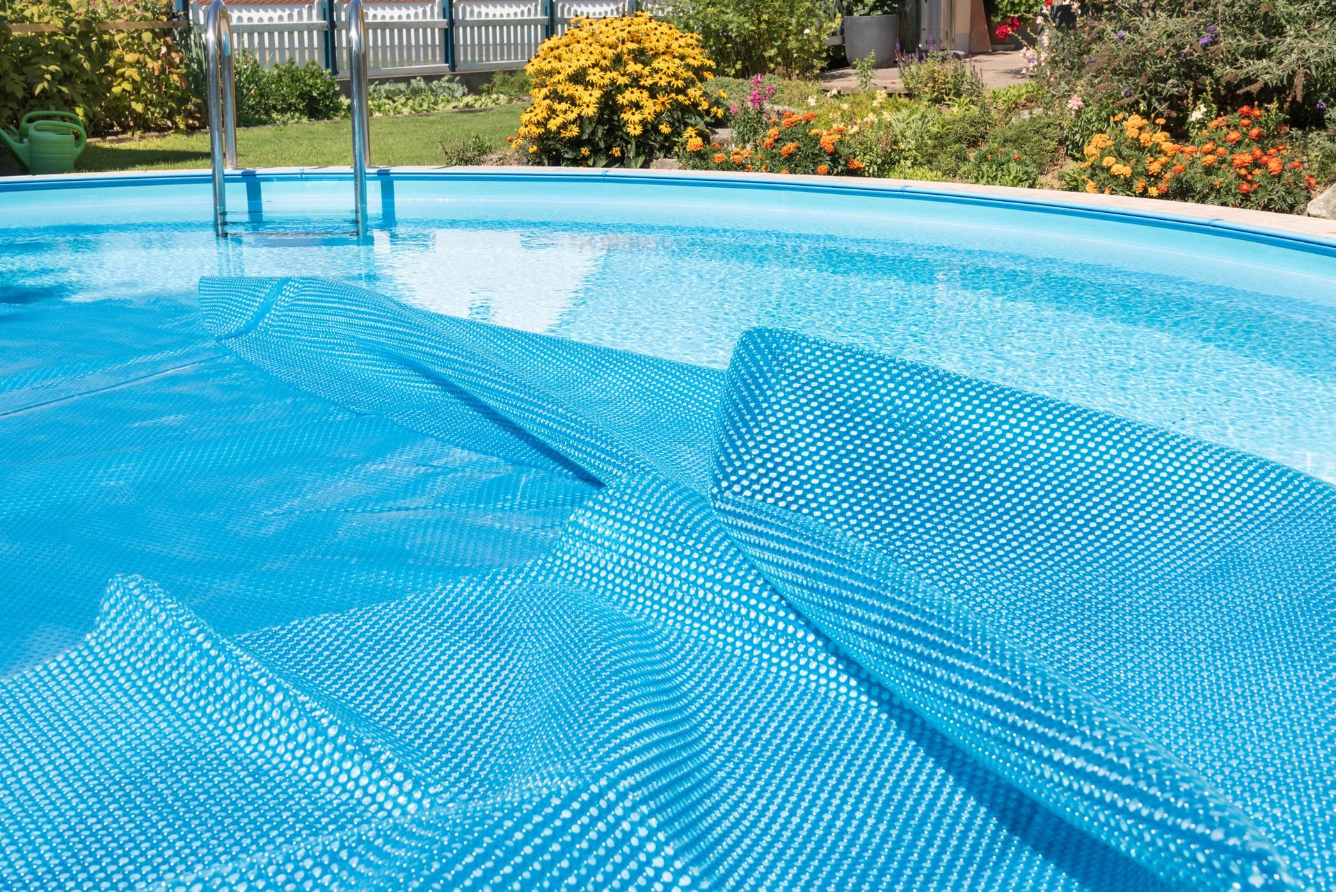A Swimming Pool with A Blue Cover on It - Provo UT - Spa Doctor
