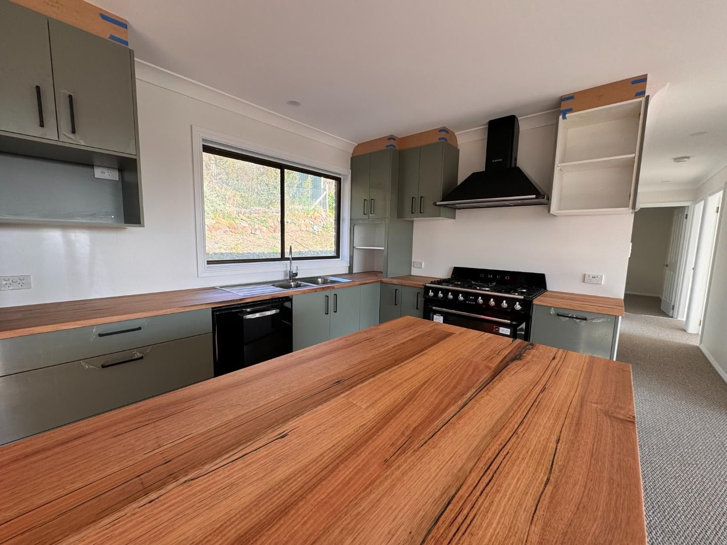 Spacious Kitchen With Wood Counters — J&C Quality Construction in Goulburn, NSW