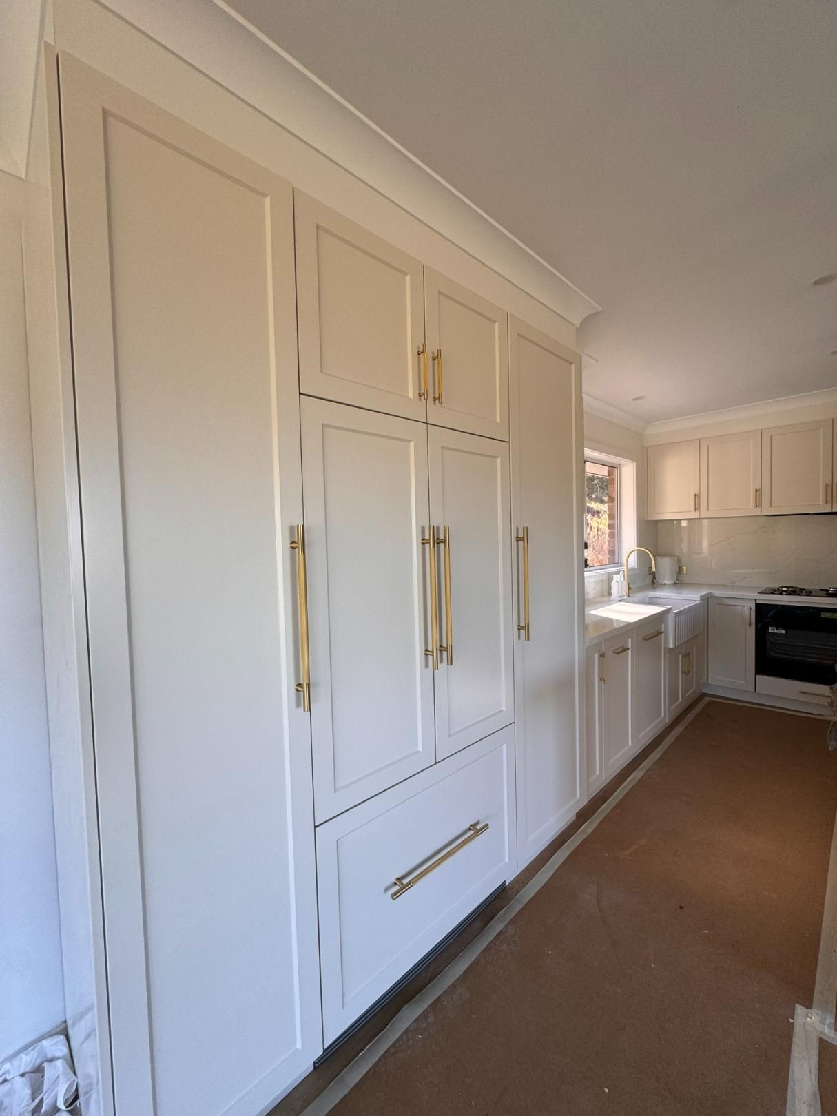 Cream-coloured Kitchen Cabinets With Gold Hardware — J&C Quality Construction in Southern Highlands, NSW