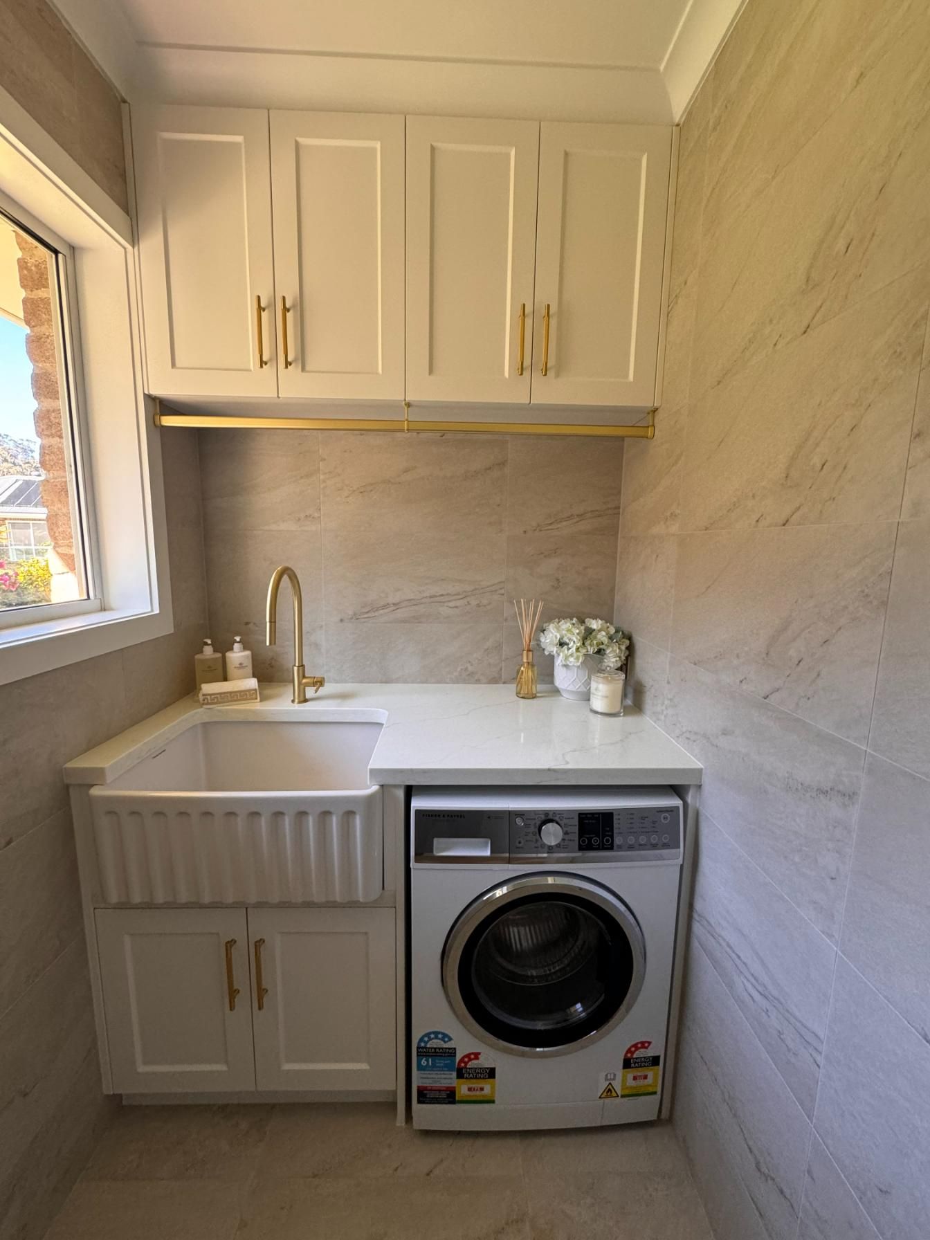 Laundry Room With White Cabinets — J&C Quality Construction in Goulburn, NSW