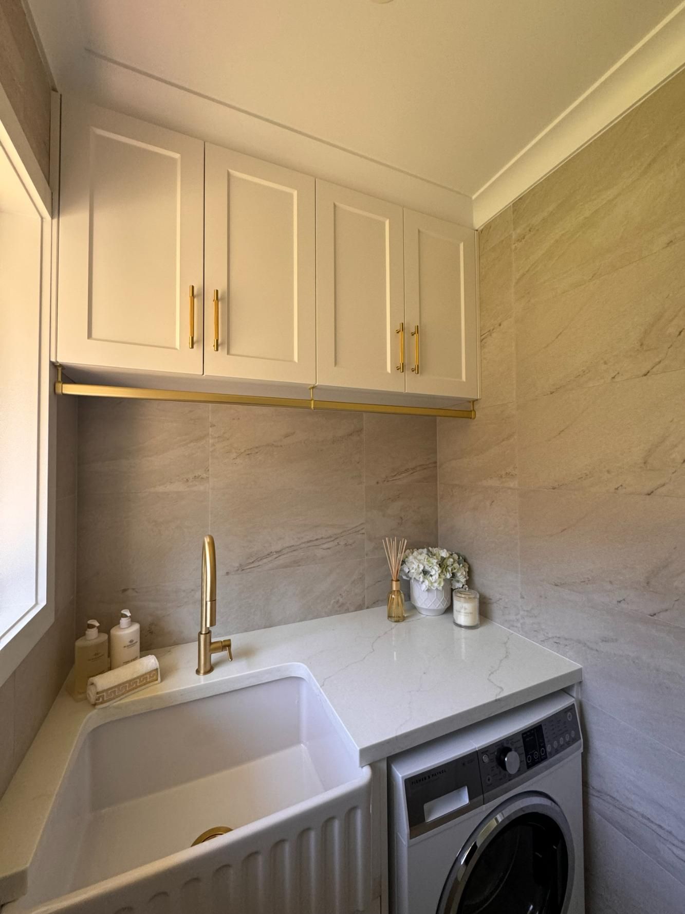 Laundry Room With White Cabinets, Gold Hardware — J&C Quality Construction in Goulburn, NSW