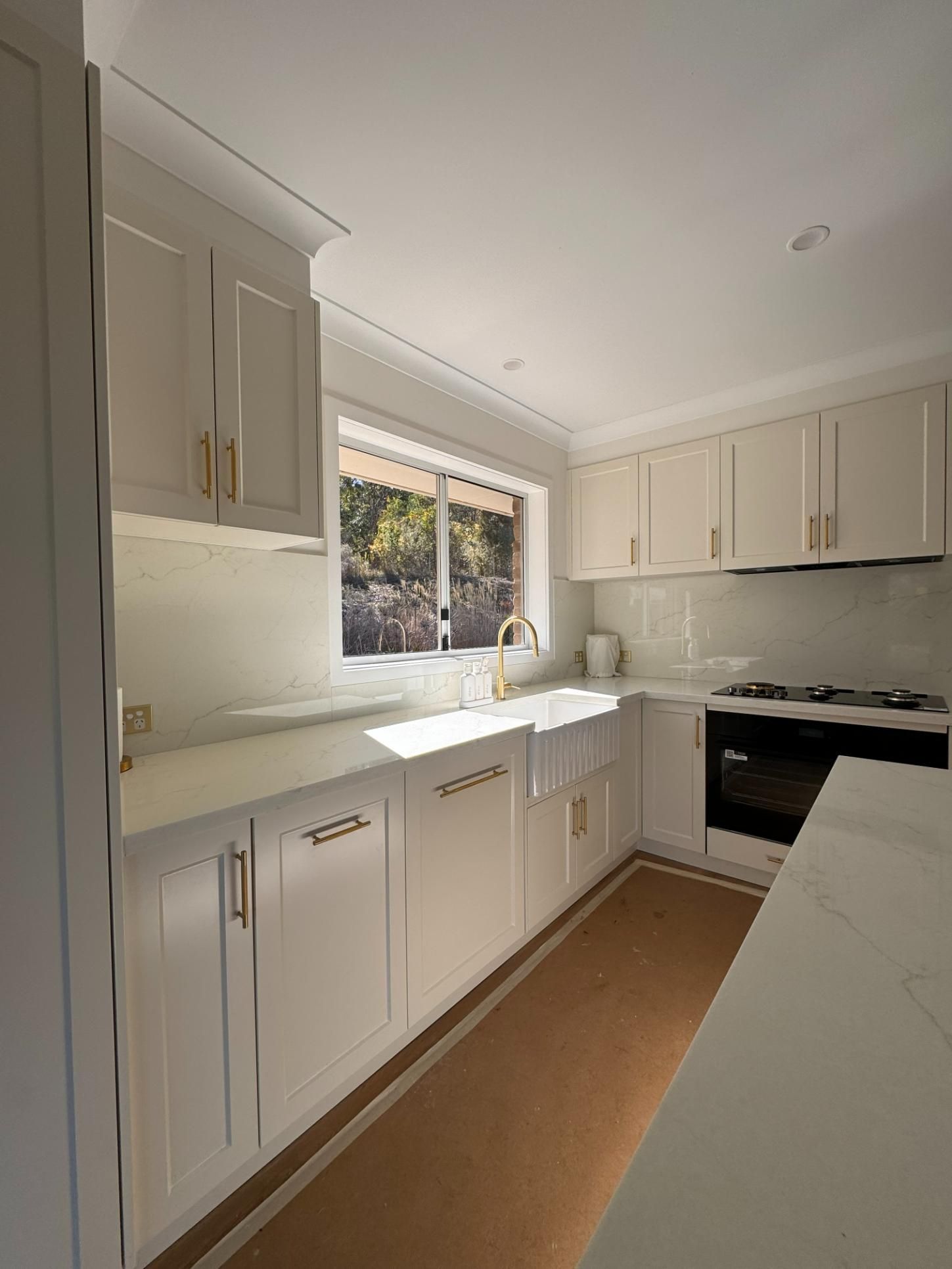 White Kitchen With Gold Hardware — J&C Quality Construction in Goulburn, NSW