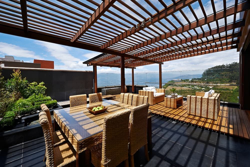 Rooftop Patio With Dining Set — J&C Quality Construction in Moss Vale, NSW