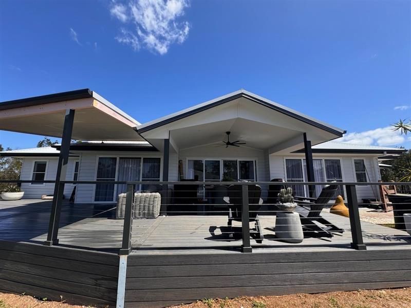 A Light-coloured House With a Dark Wooden Deck — J&C Quality Construction in Canberra, ACT