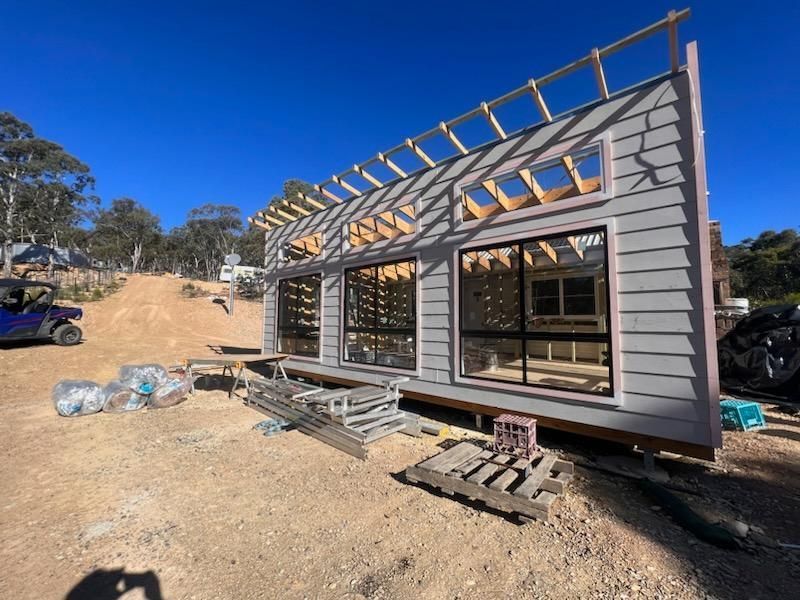 Construction of a Modern Grey House With Large Windows — J&C Quality Construction in Goulburn, NSW