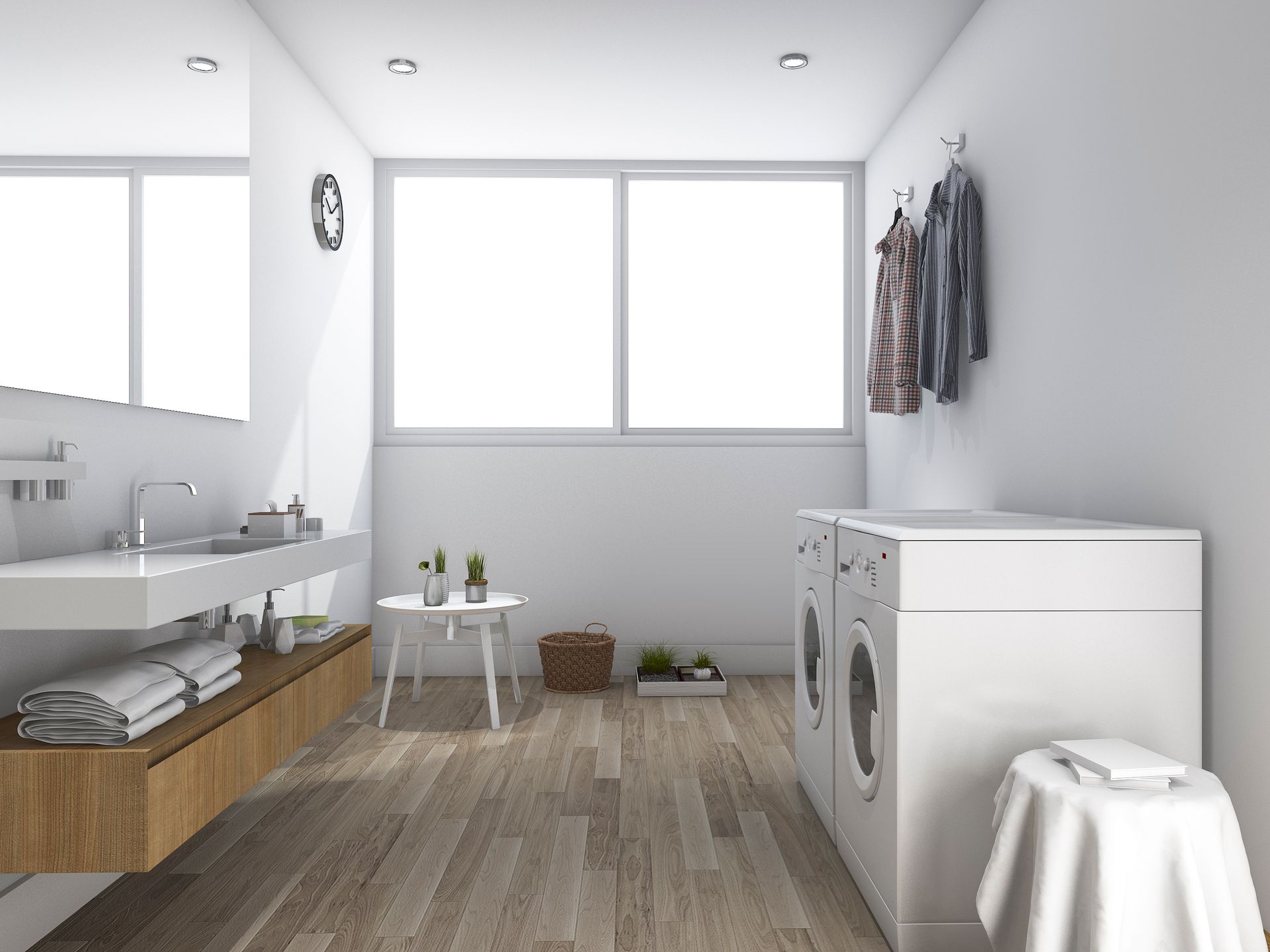 A bathroom with a sink , washing machine , and dryer.