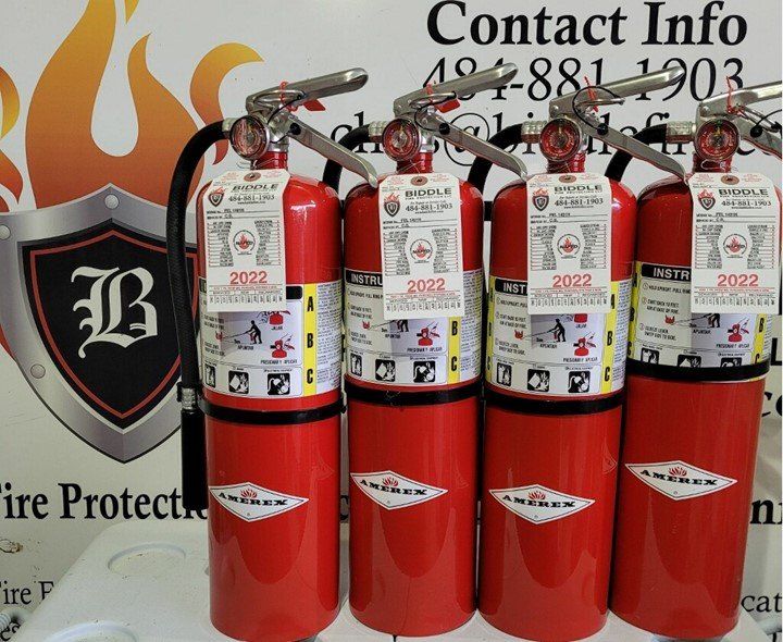 Four Fire Extinguishers Standing — Fire Extinguisher in Coatesville, PA Four Fire Extinguishers Standing — Fire Extinguisher in Coatesville, PA