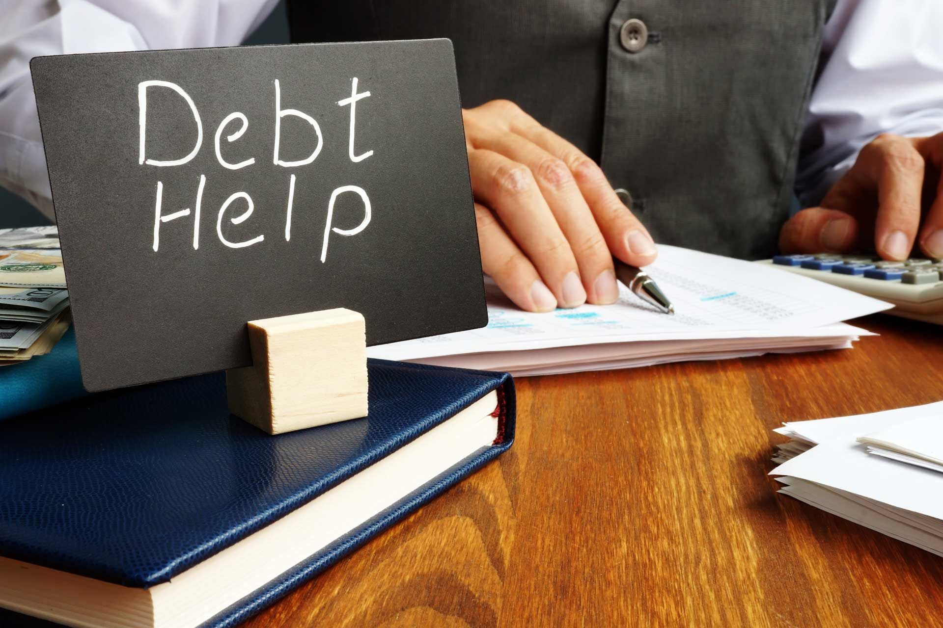 Person calculating finances with 