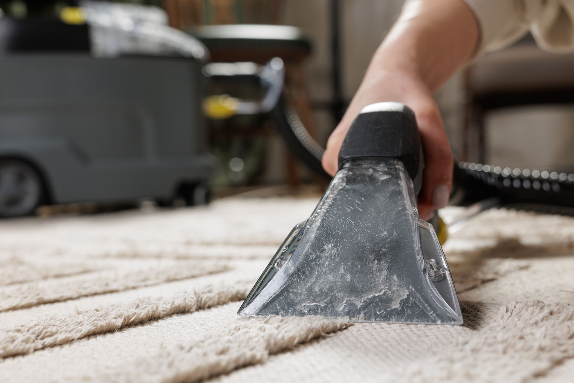 Yellow crumpled paper balls near a metal trash bin on a gray surface.