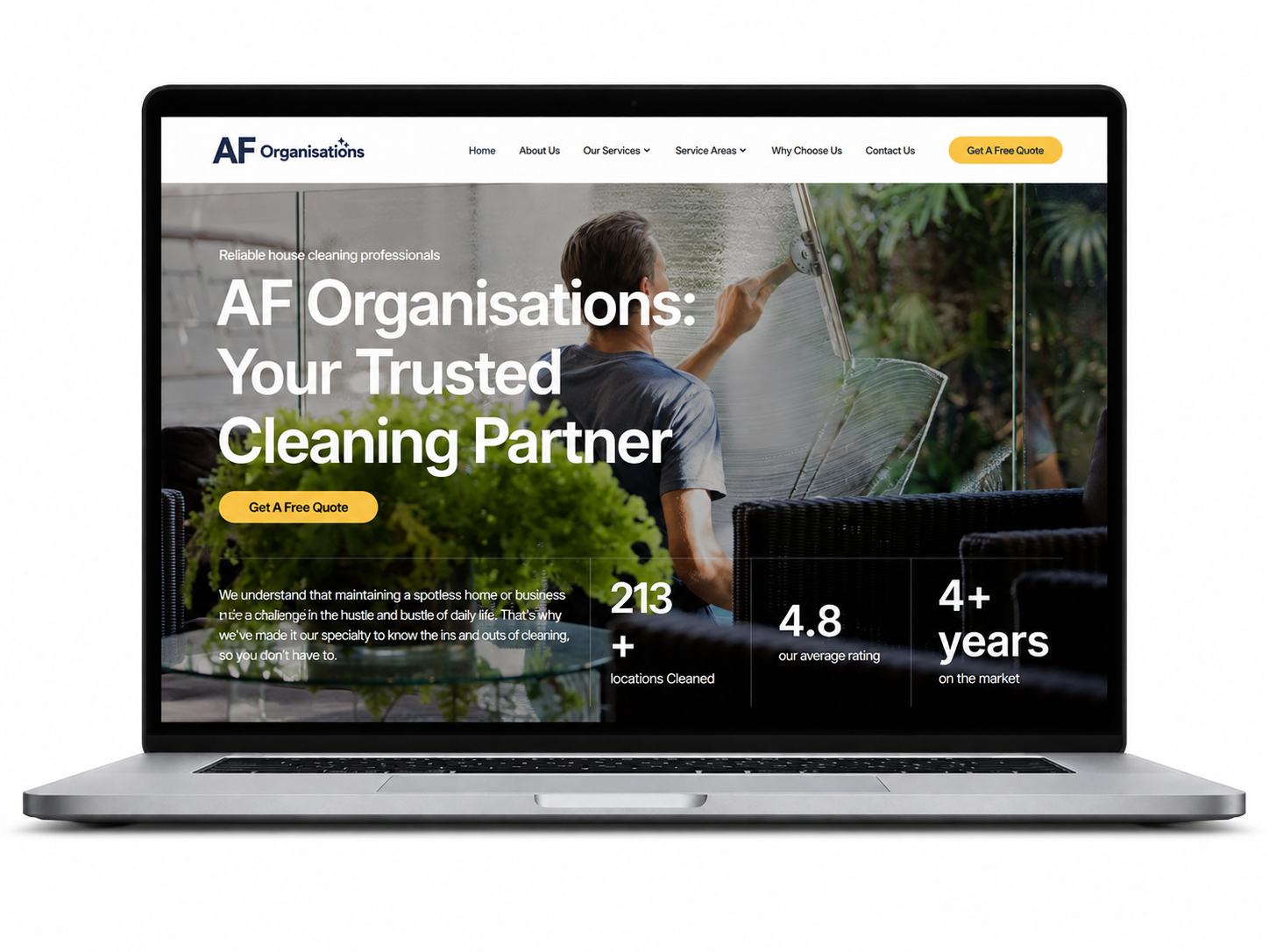Laptop displaying a cleaning company website with bold white text over a dark background and green call-to-action buttons