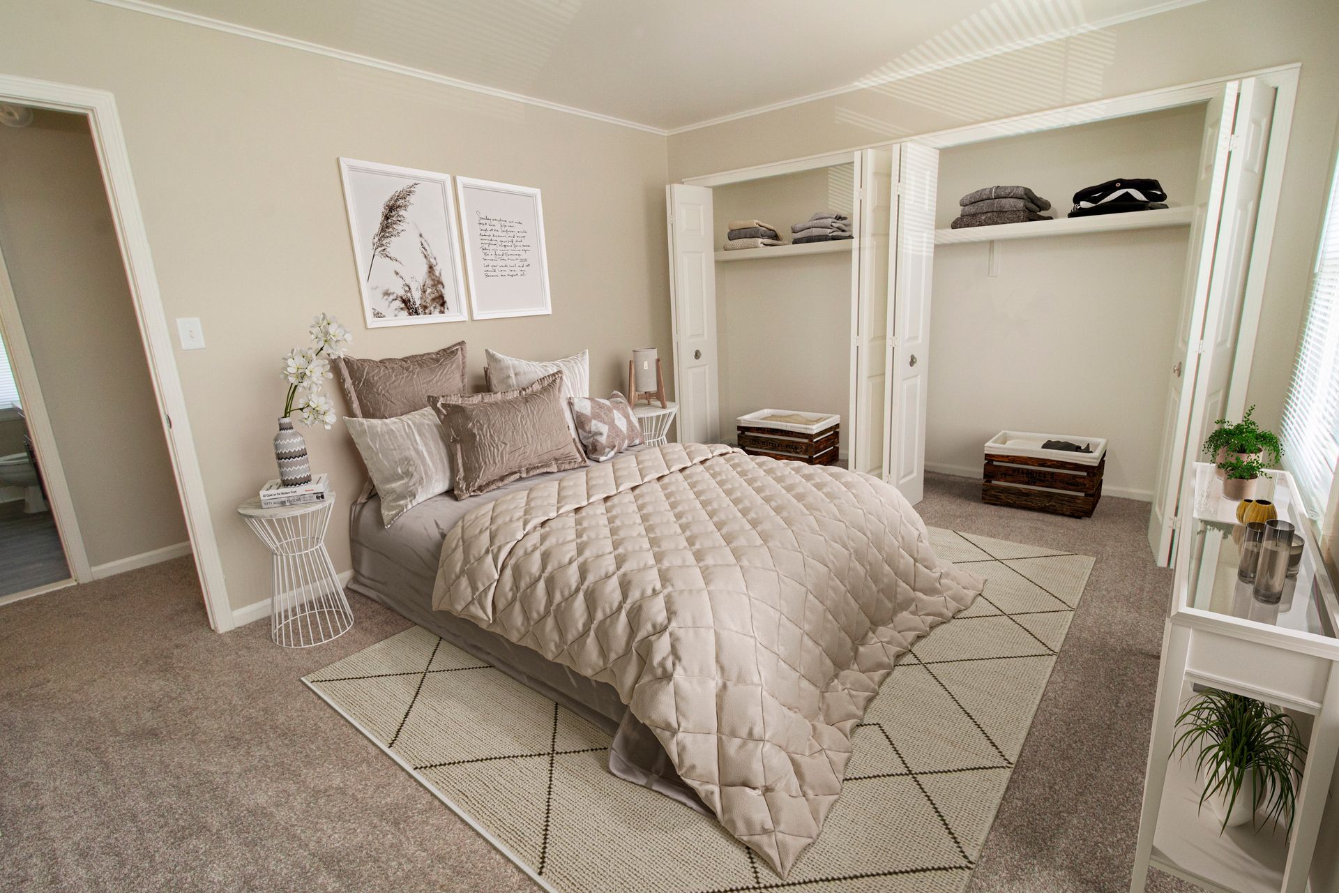A bedroom with a bed , dresser , and closet.