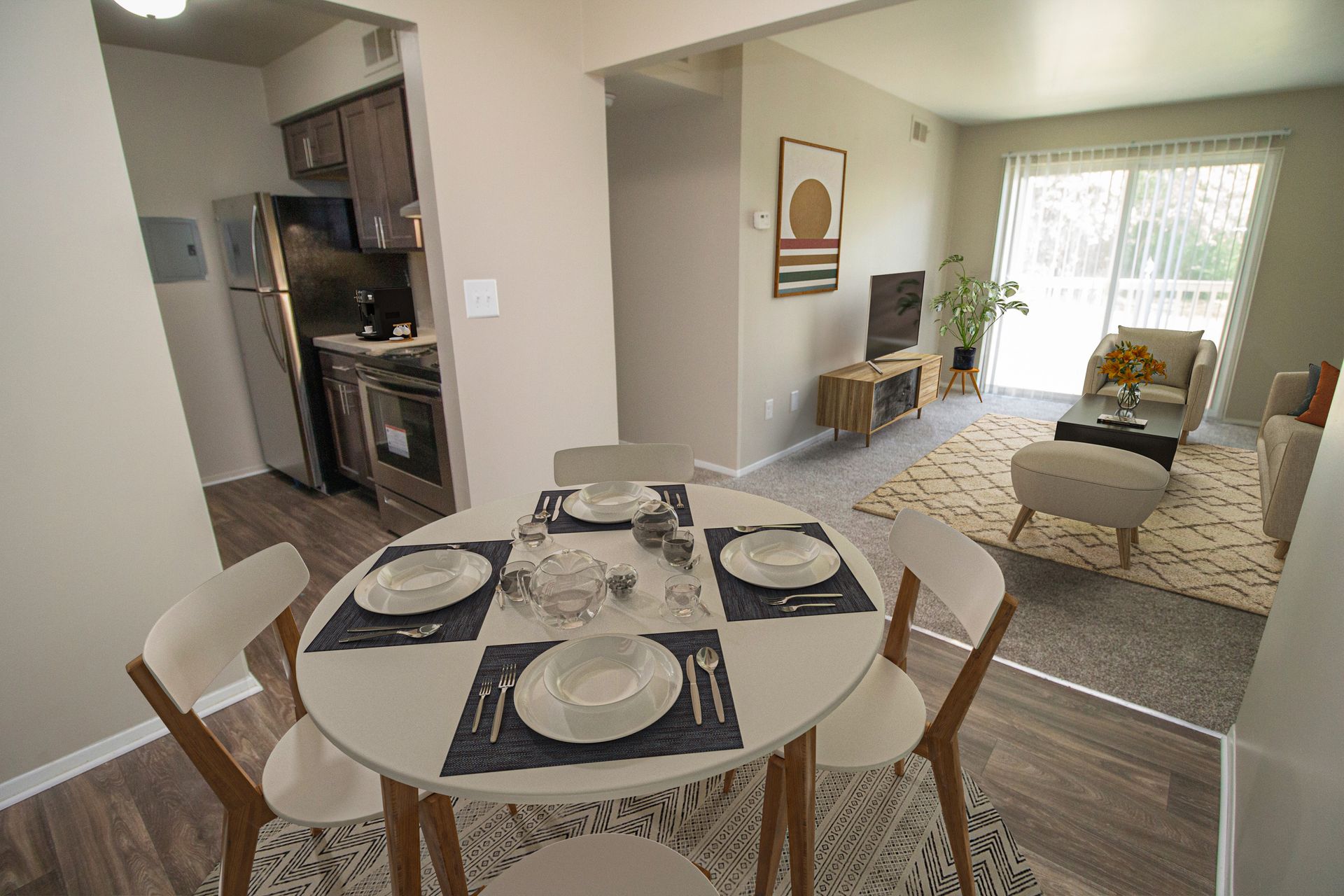 There is a dining table in the middle of the room.