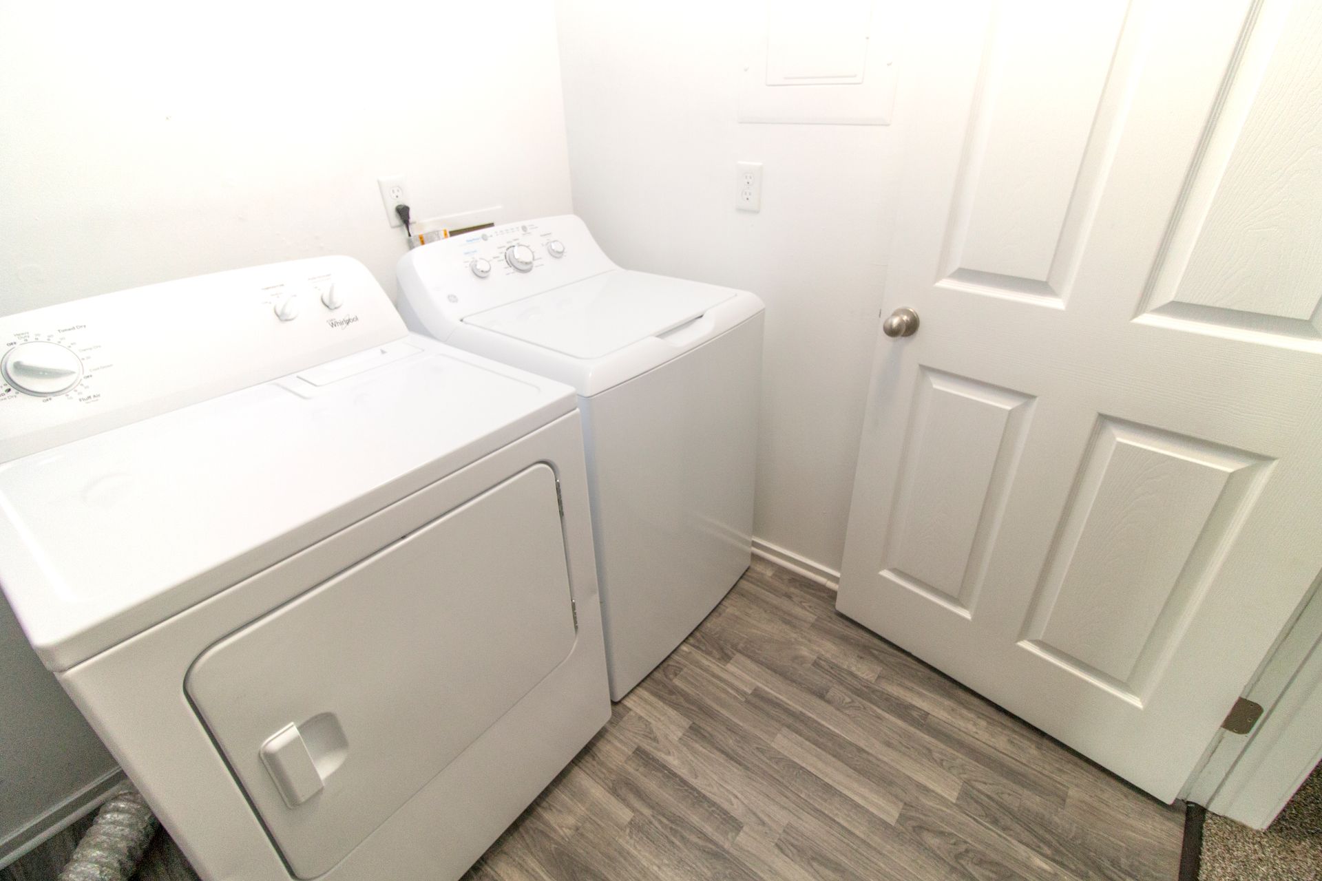 A laundry room with a washer and dryer in it.