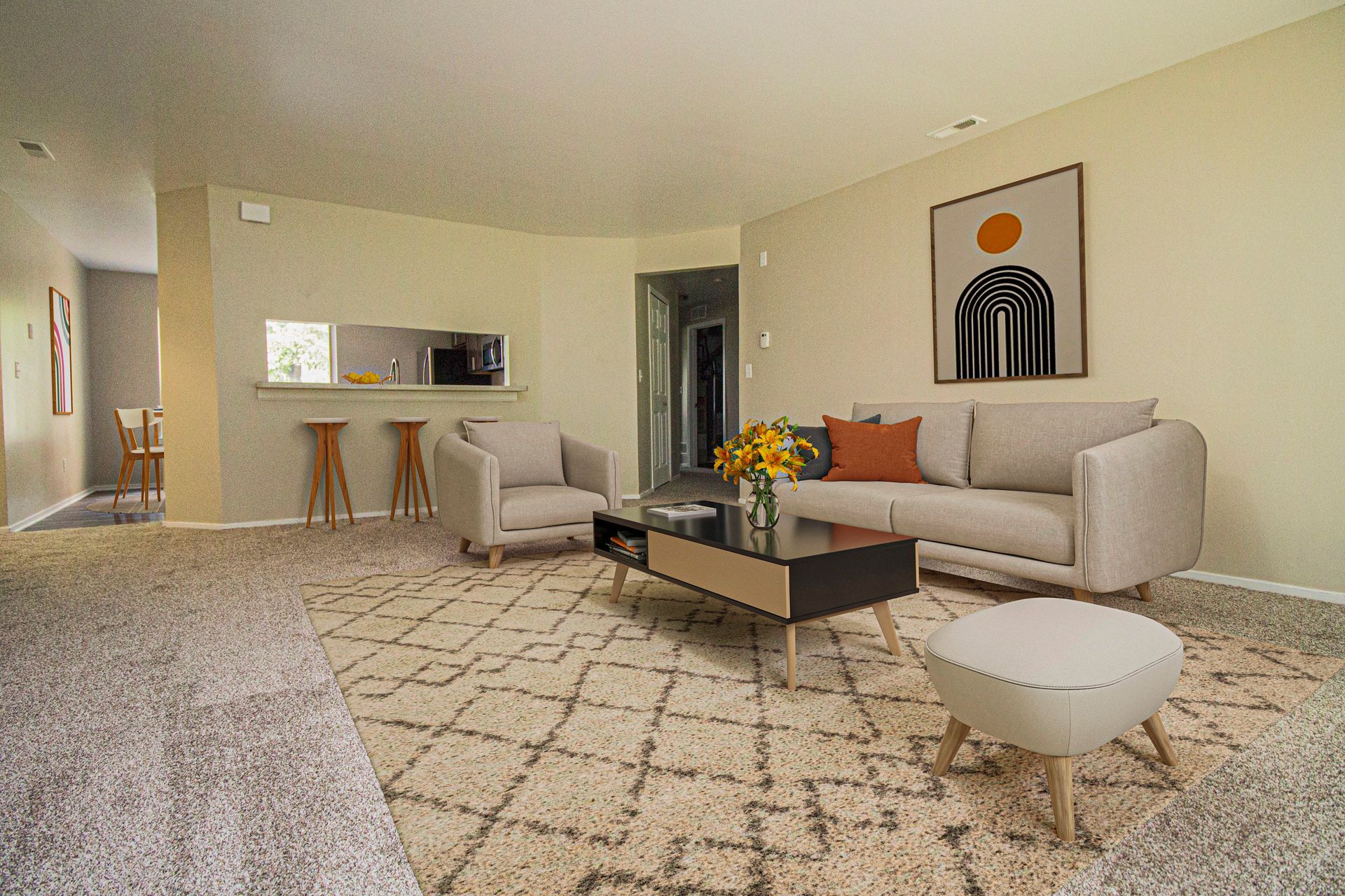 A living room with a couch , chairs , coffee table and rug.