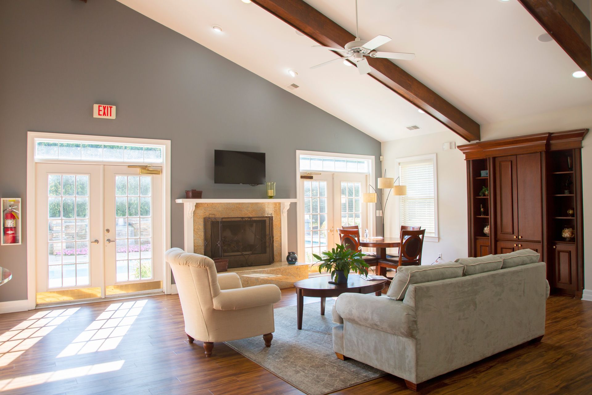 A living room filled with furniture and a fireplace.