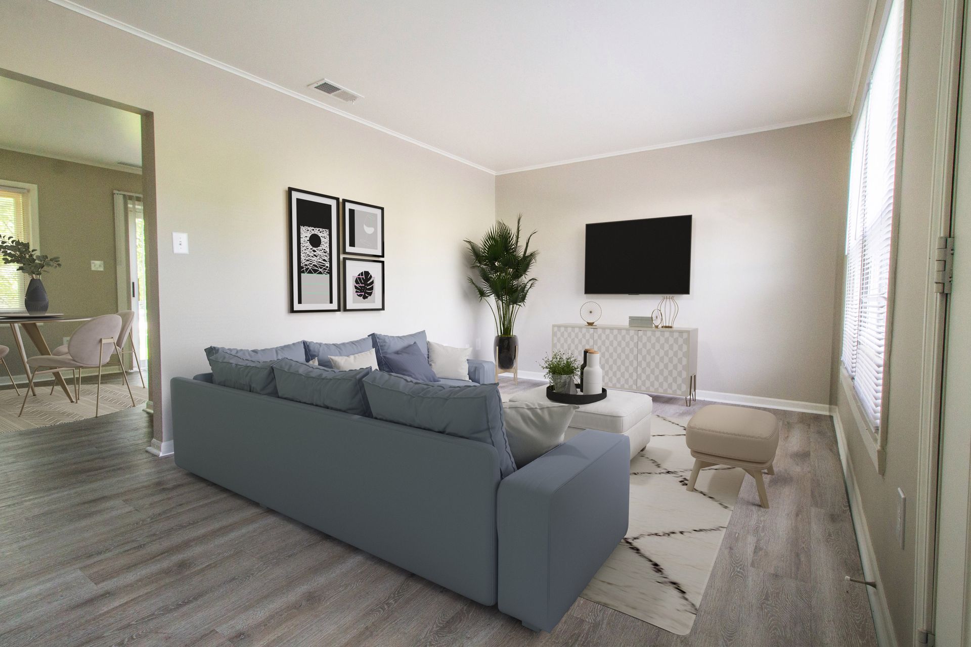 A living room with a couch and a flat screen tv.