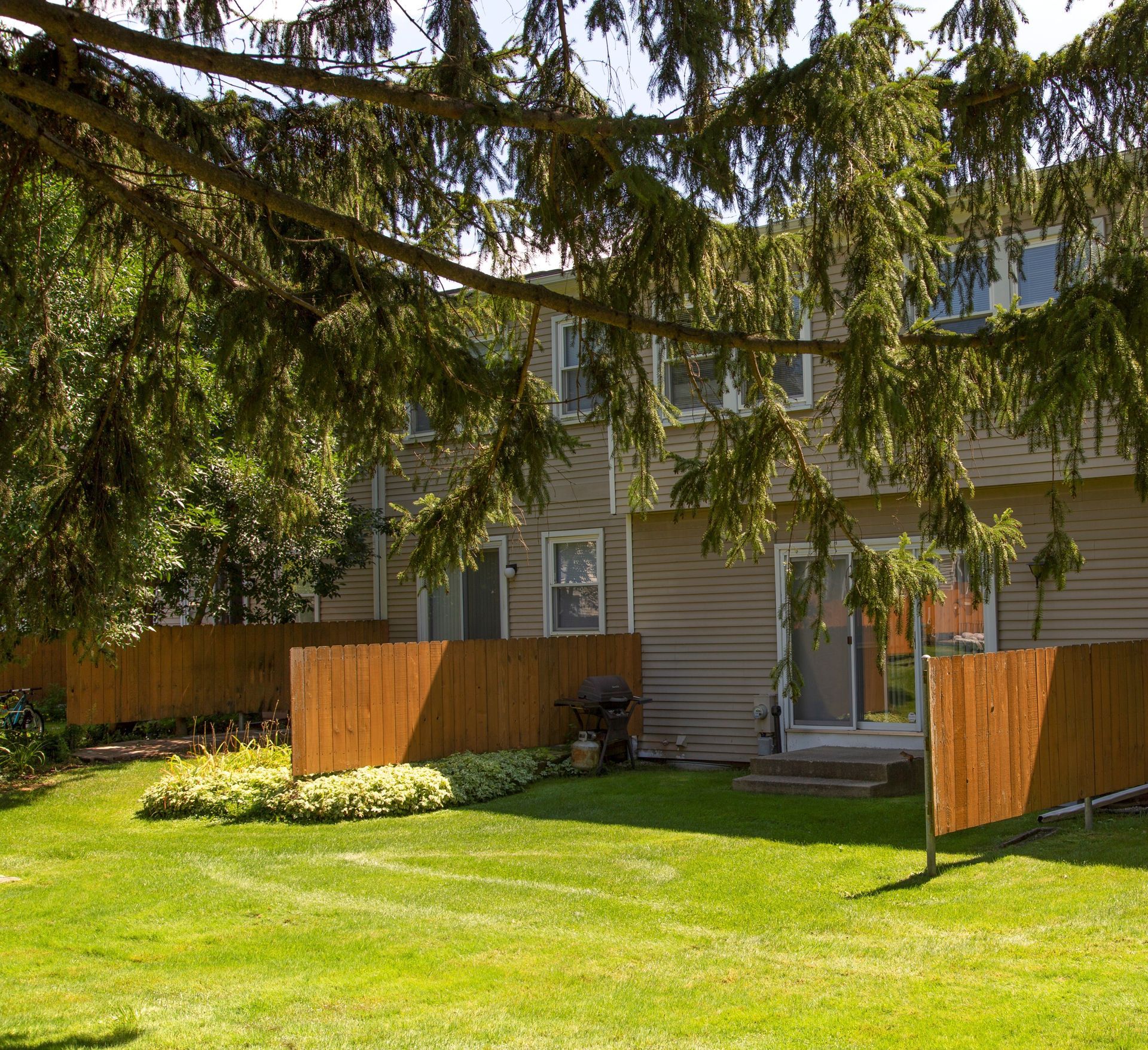 A house with a wooden fence in front of it