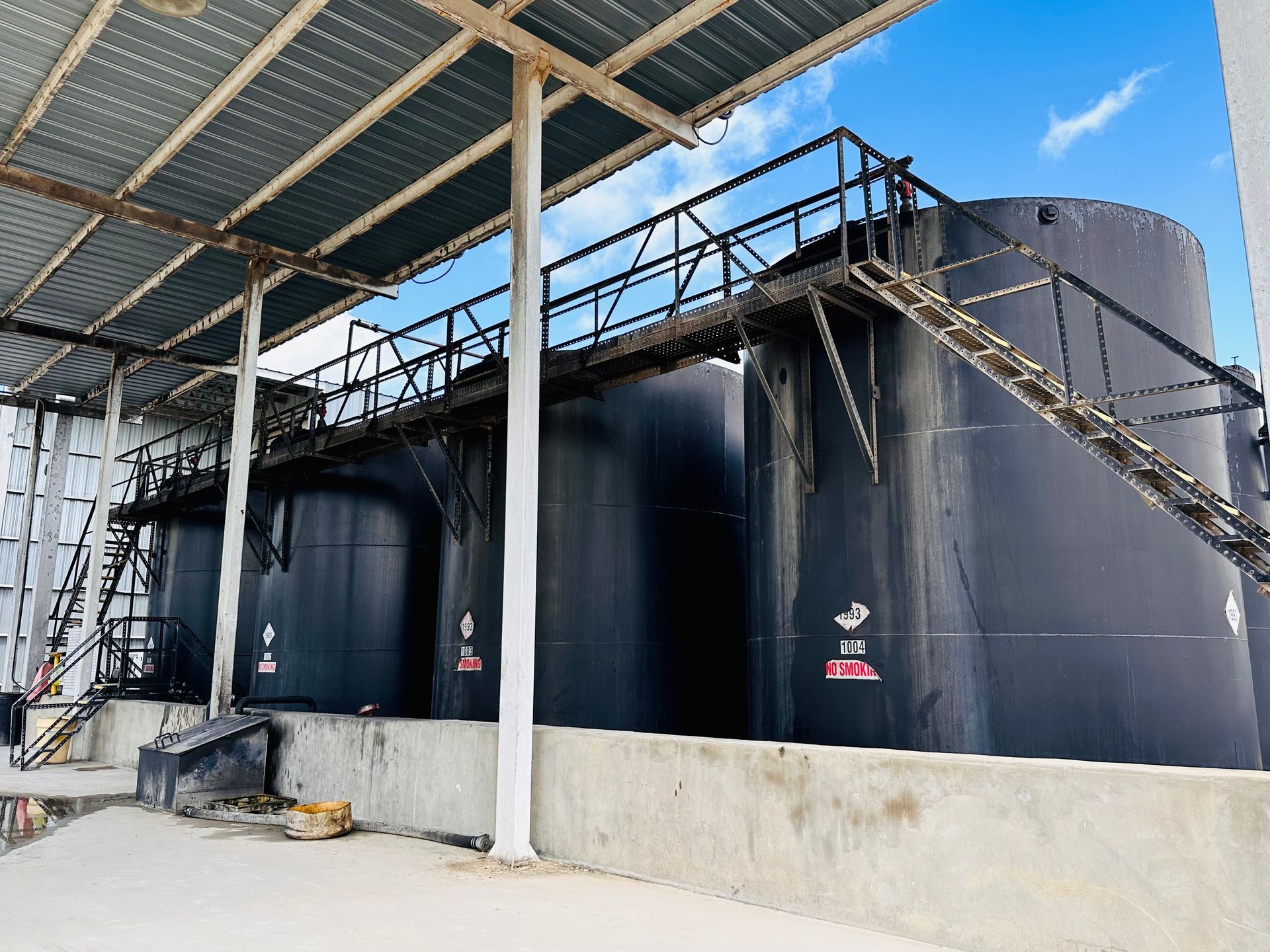 Workers in Protective Gear Doing Hazmat — Somerset, TX — Approved Oil Services LLC Workers in Protective Gear Doing Hazmat — Somerset, TX — Approved Oil Services LLC