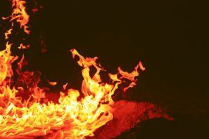 A close up of a fire on a black background.