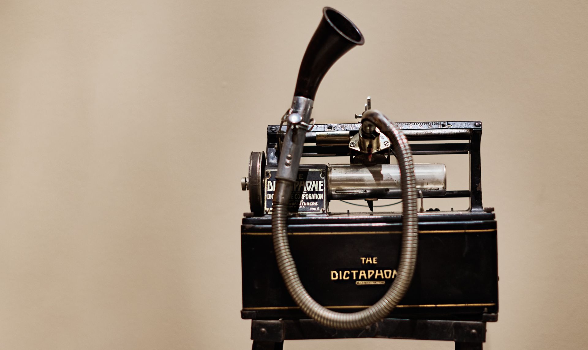 Antique black Dictaphone with silver tubing and a black speaker horn.