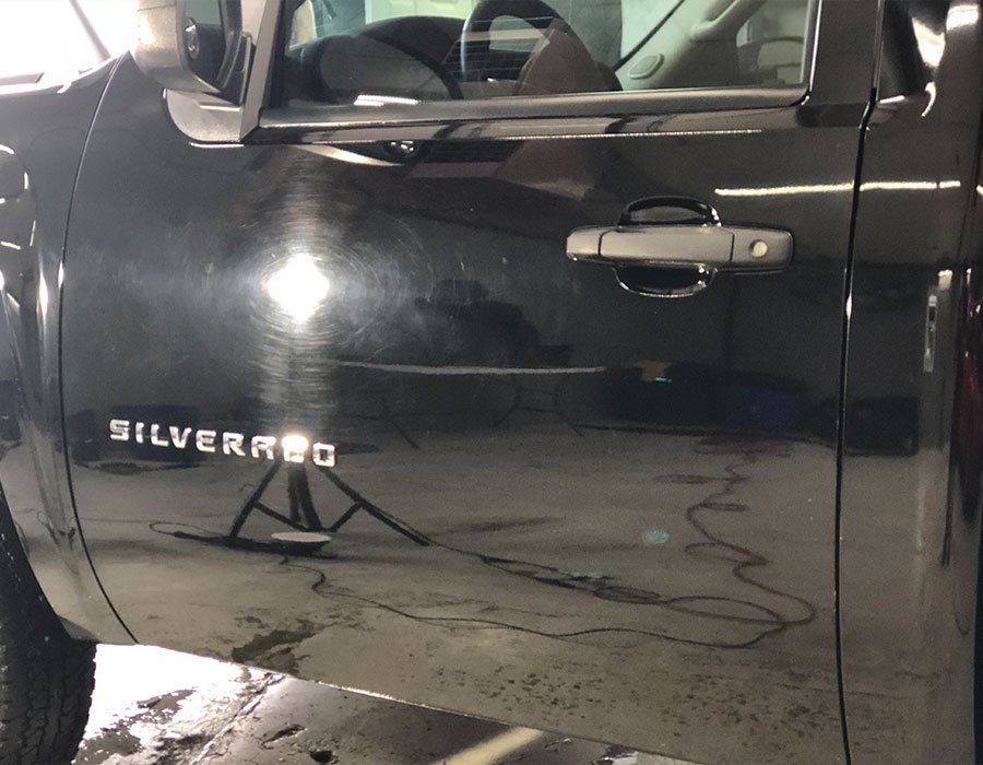 black car before paint correction