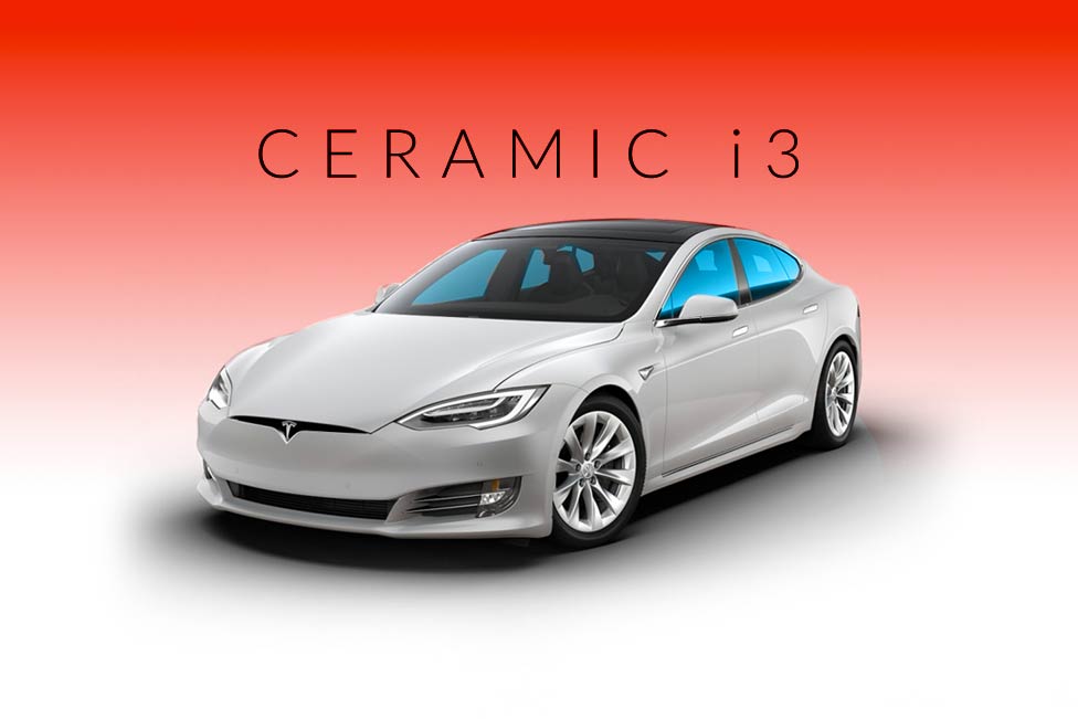 A white tesla model s is sitting on a red background.