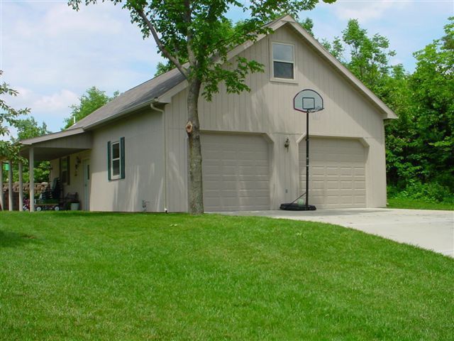 A house with a basketball hoop in front of it