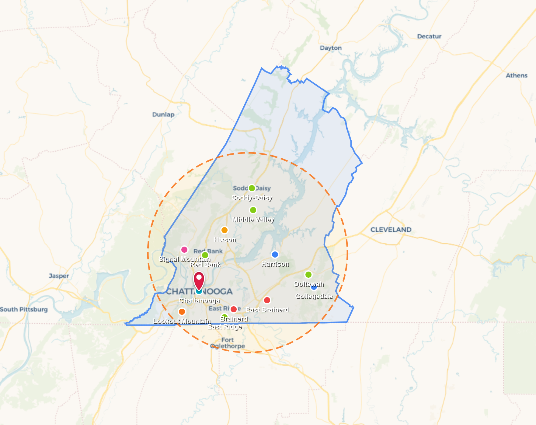 Map with a green and blue outlined region, clustered markers, and a dashed circular area around central locations
